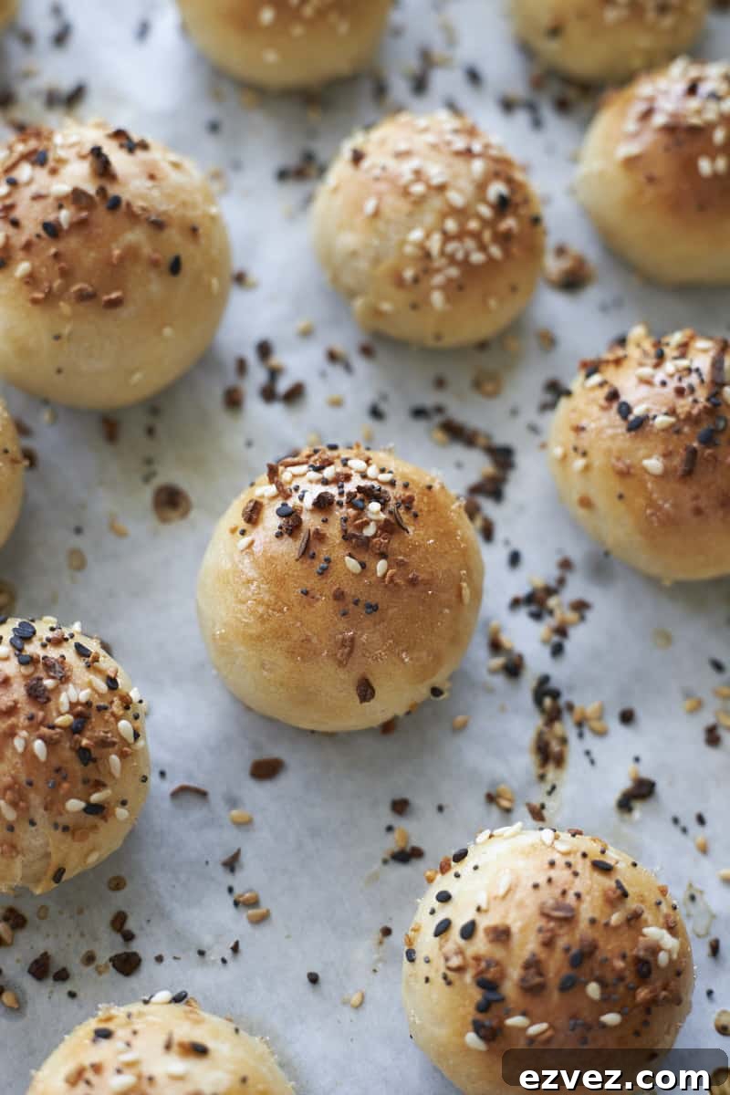 Sourdough discard bagel bites on parchment paper after baking.