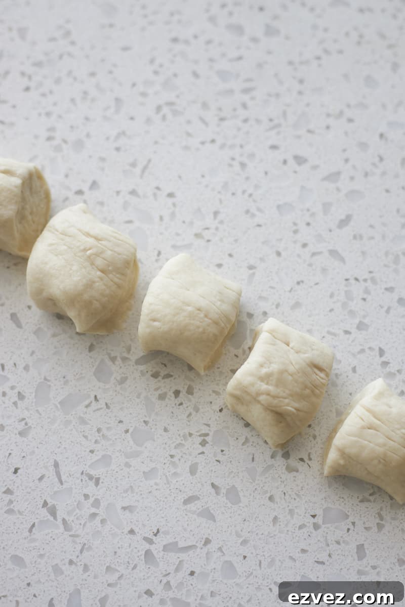 Dough rope cut into pieces.