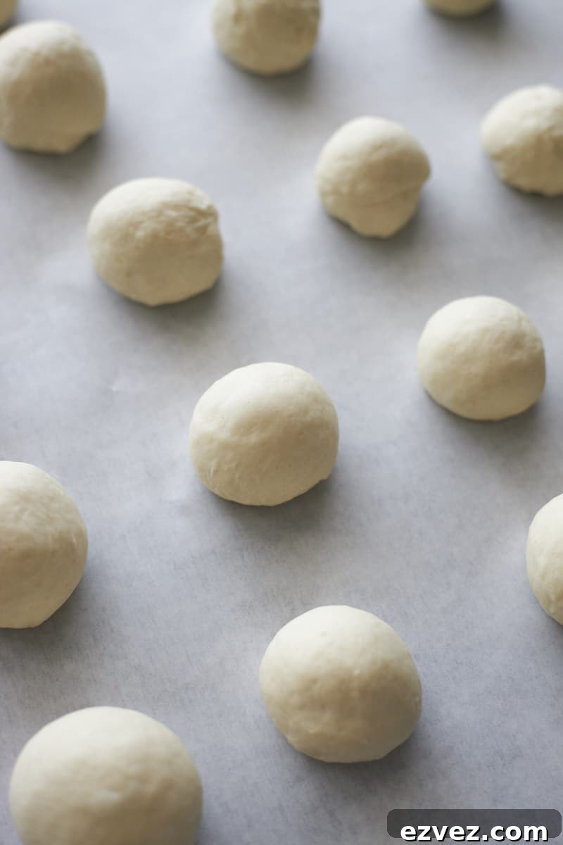 Shaped bagel bites on parchment paper.