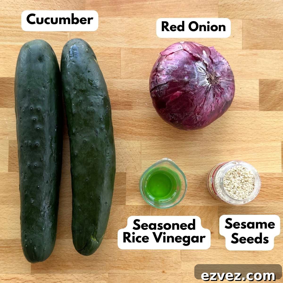 Ingredients to make cucumber salad: 2 cucumbers, red onion, season riced vinegar, and sesame seeds.