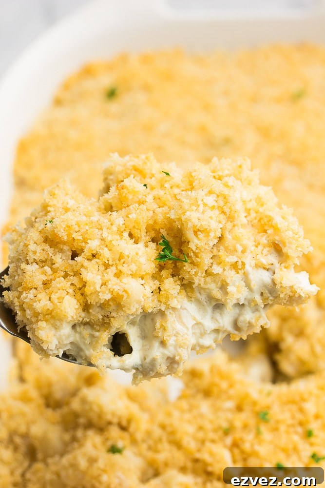 spoon taking a serving out of vegan baked mac and cheese
