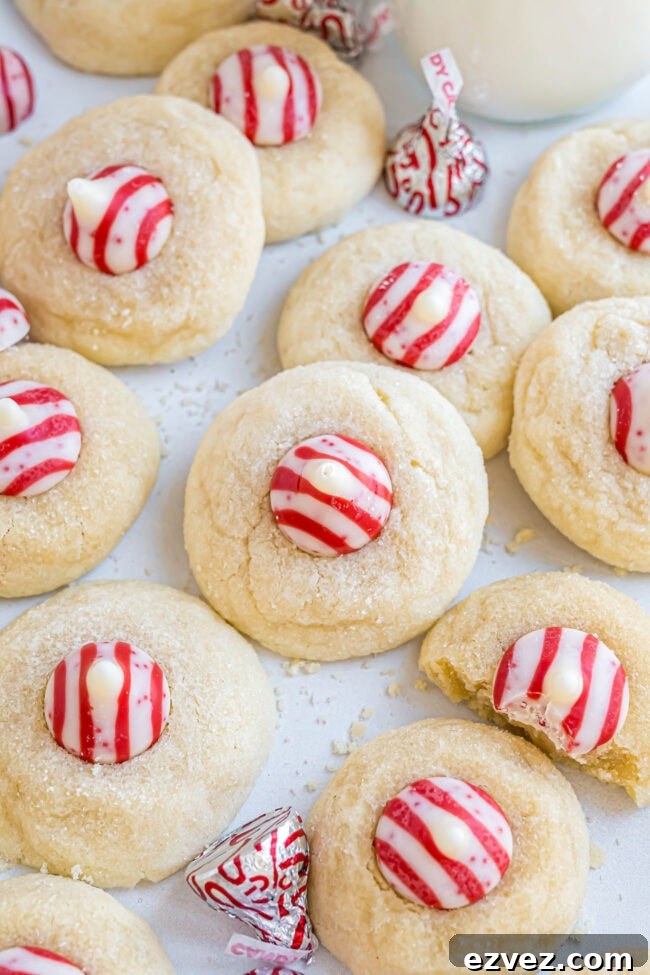 Large batch of Candy Cane Kiss Cookies displayed on the counter for holiday snacking