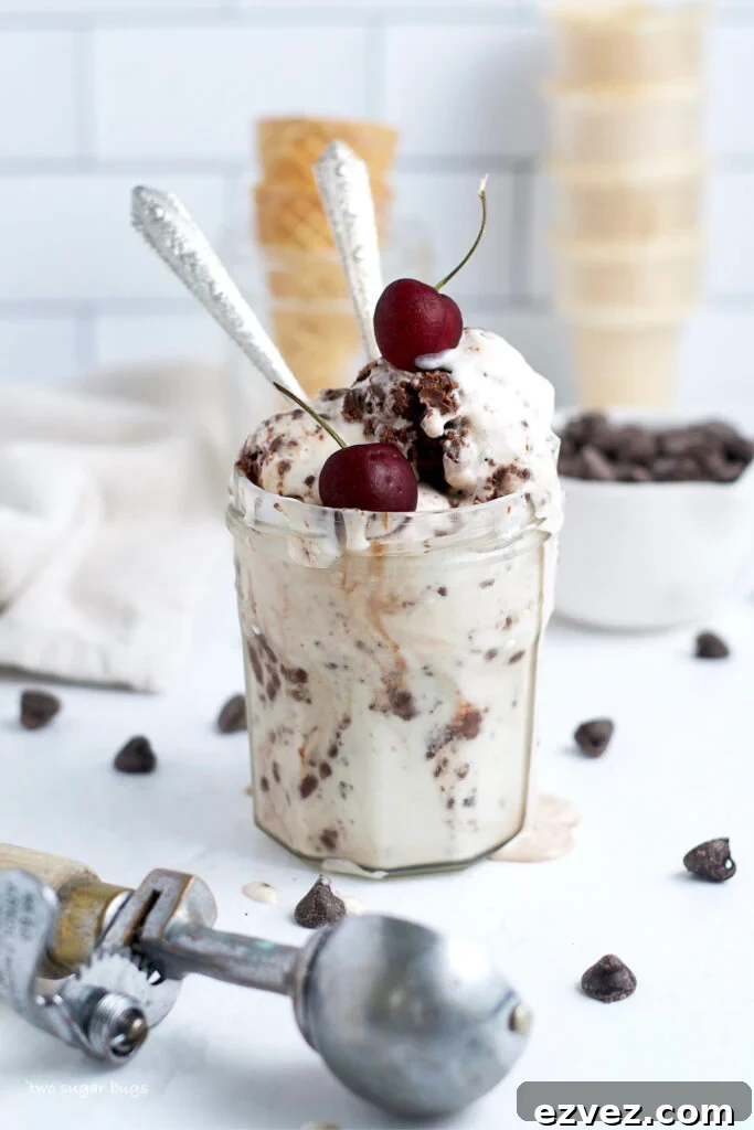 Brownie Batter Ice Cream Recipe: Rich Homemade Ice Cream with Fudge Chunks 3 ice cream in a glass jar with cherries on top