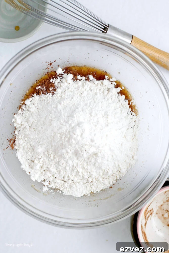 Brownie Batter Ice Cream Recipe: Rich Homemade Ice Cream with Fudge Chunks 7 cocoa powder and heat treated flour added to wet ingredients in a bowl