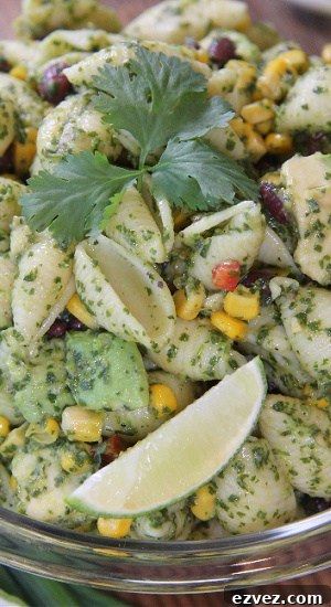 A delicious salad, or side dish served cold with black beans, avocado, and a cilantro pesto sauce.
