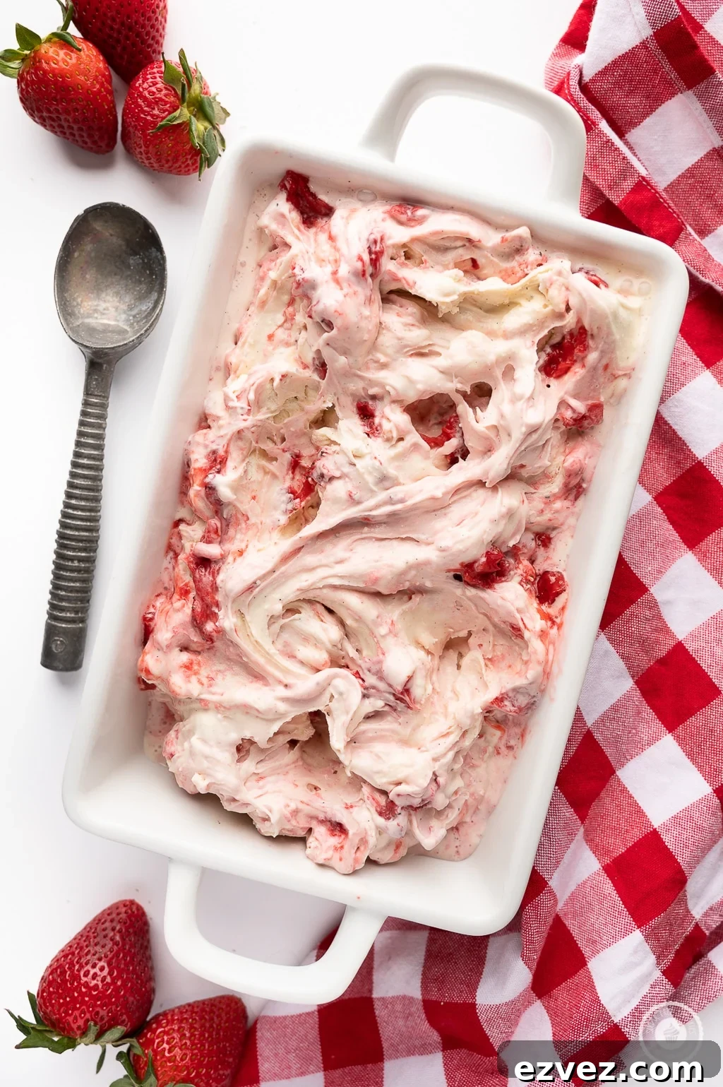 A fresh batch of strawberry cheesecake icecream, swirled with strawberry bit, ready for Valentine's day.