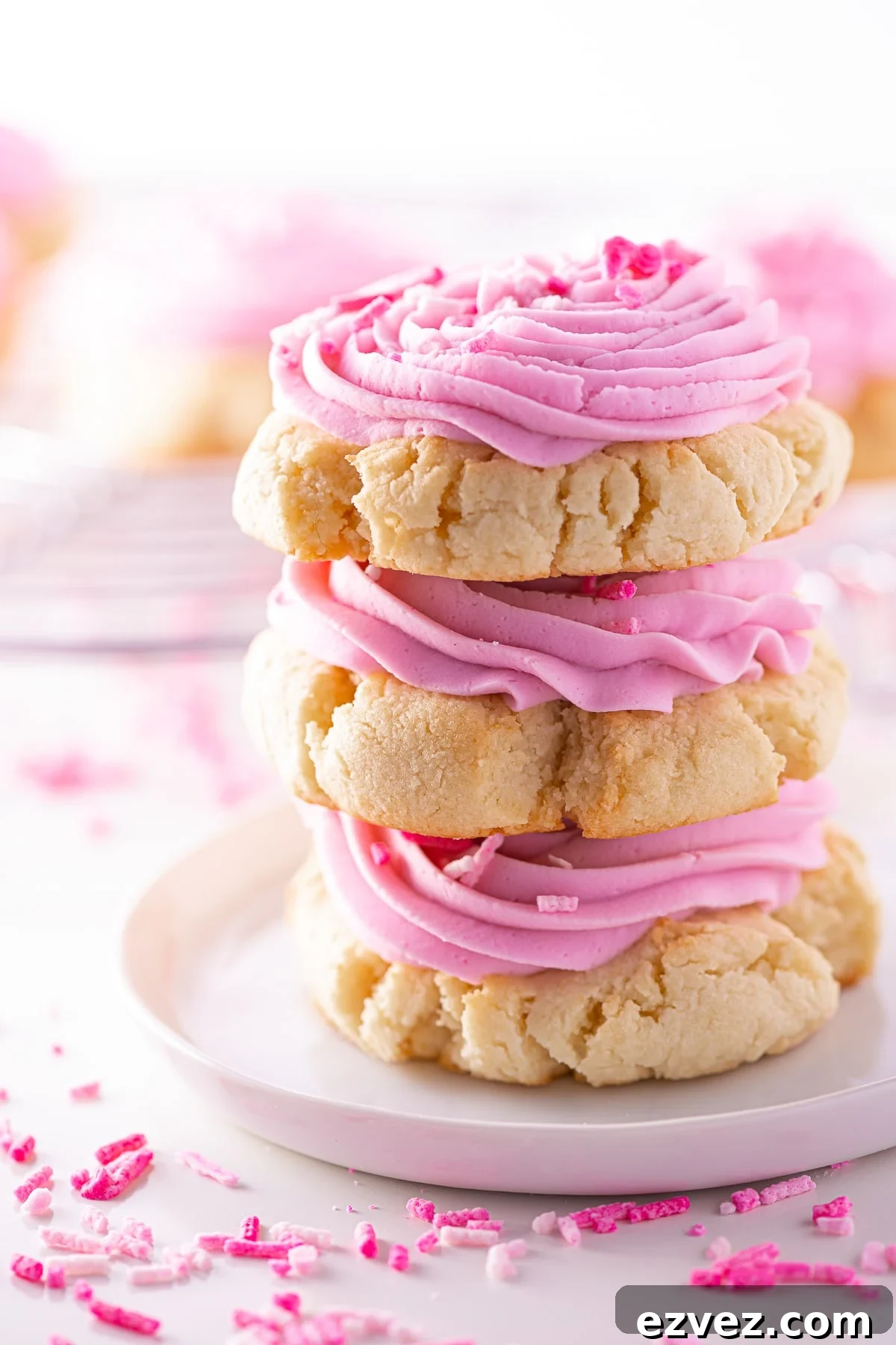 A stack of keto sugar cookies, with pink frosting for Valentine's day.