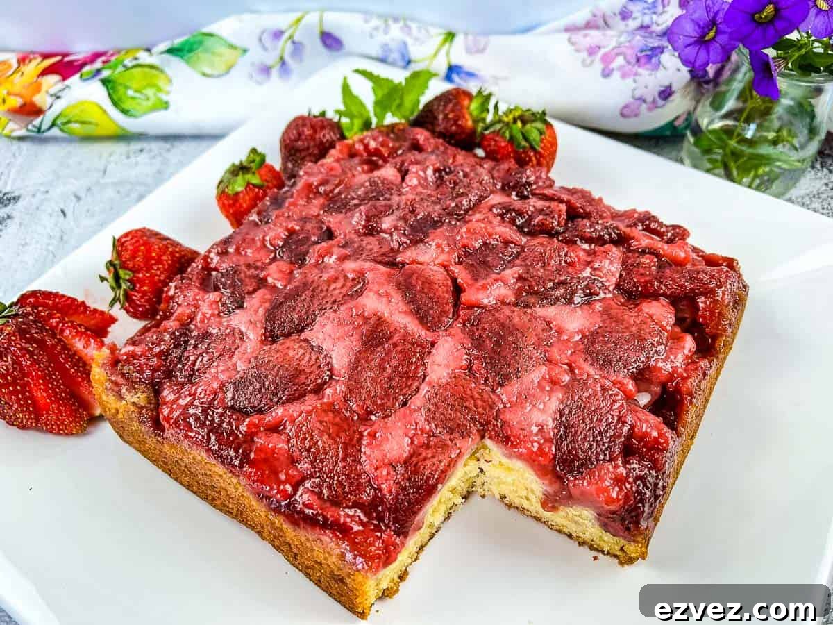 Strawberry Upside Down Cake with a slice missing.