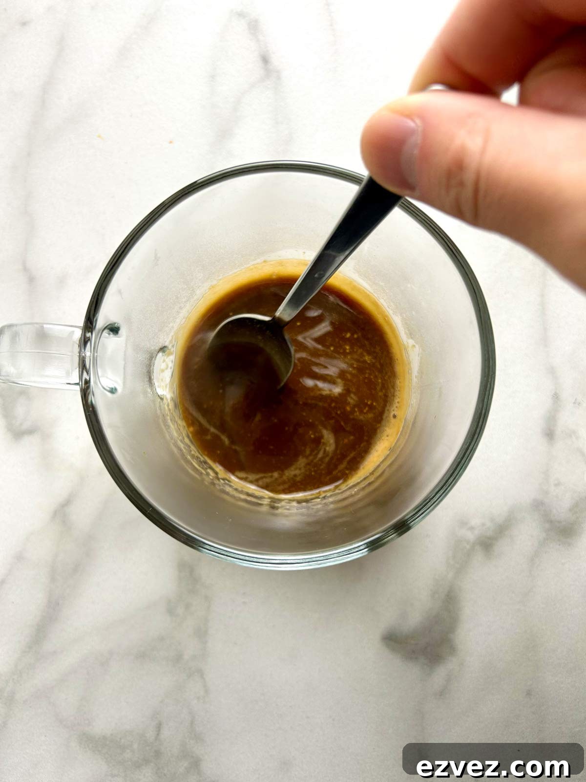 stirring boiling water with coffee and hot chocolate mix