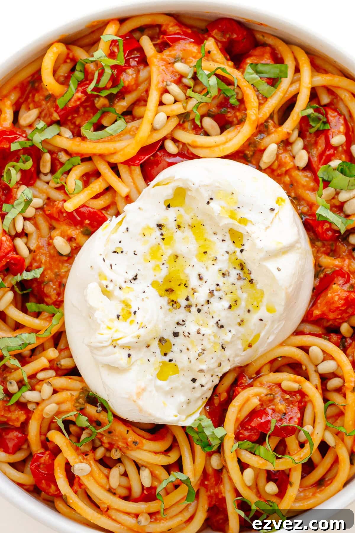 Creamy Burrata Pasta with Cherry Tomato Garlic Butter Sauce 2 Large white serving bowl of burrata pasta with cherry tomato sauce.