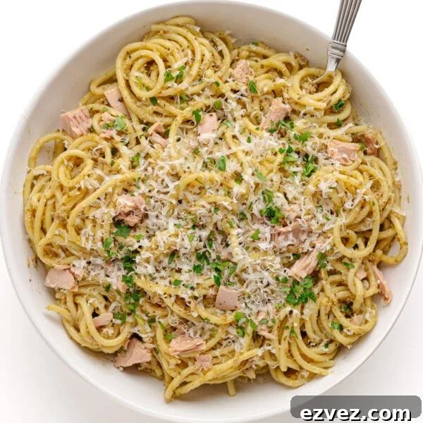 Creamy Burrata Pasta with Cherry Tomato Garlic Butter Sauce 14 Tuna pesto pasta in a white bowl with fork.