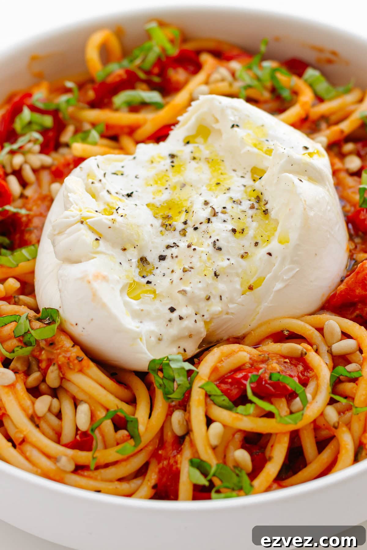 Creamy Burrata Pasta with Cherry Tomato Garlic Butter Sauce 3 Serving bowl of cherry tomato pasta with burrata on top.