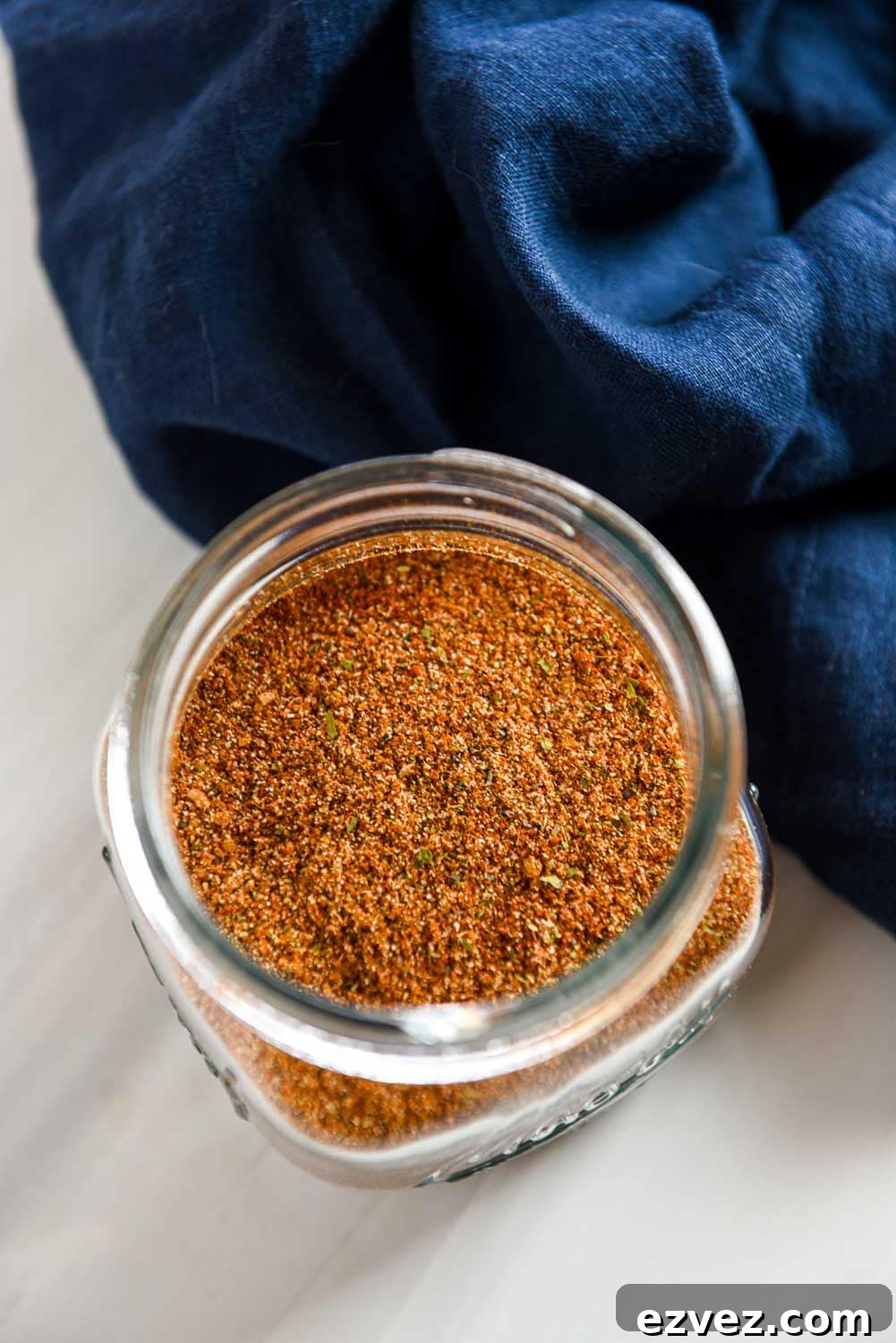 looking into a glass jar filled with homemade fajita seasoning