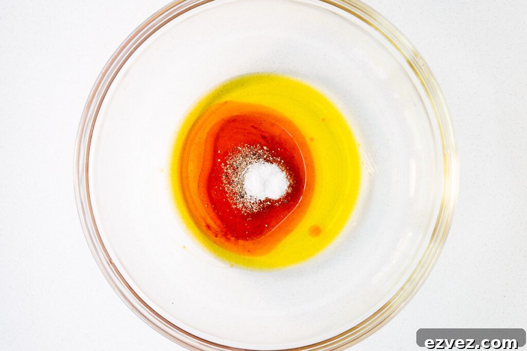 The hot honey marinade ingredients in a large glass bowl.