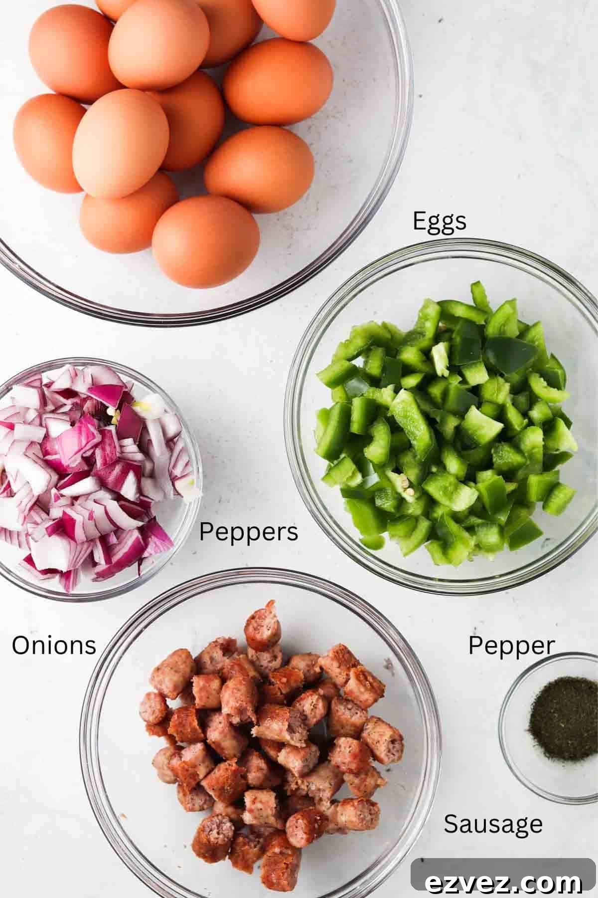 Egg frittata ingredients in glass bowls.