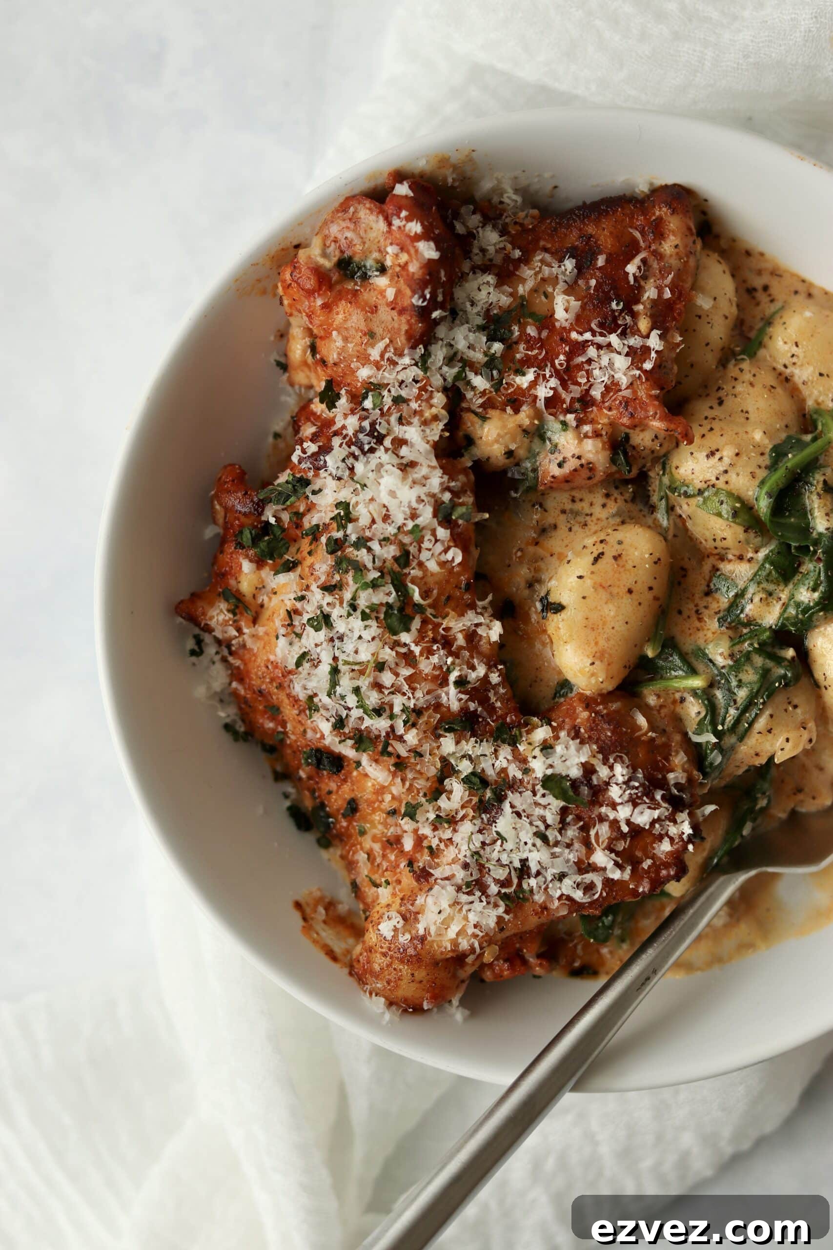 Creamy Chicken Gnocchi with Spinach and Parmesan 12 chicken and gnocchi in cream sauce in a bowl