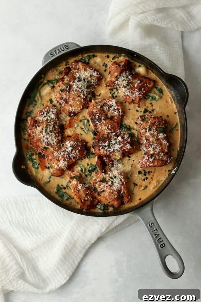 Creamy Chicken Gnocchi with Spinach and Parmesan 9 chicken thighs with gnocchi and spinach in cream sauce in cast iron skillet