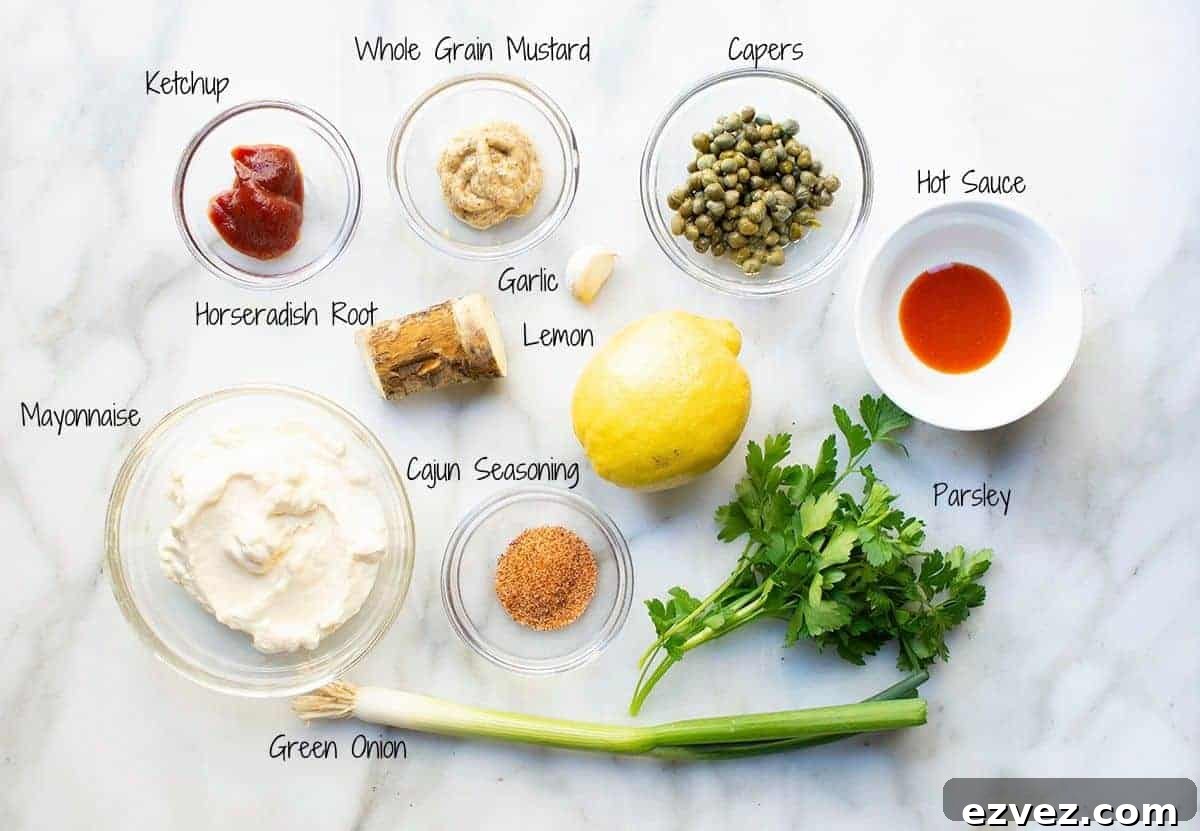 remoulade sauce ingredients in bowls on a marble surface