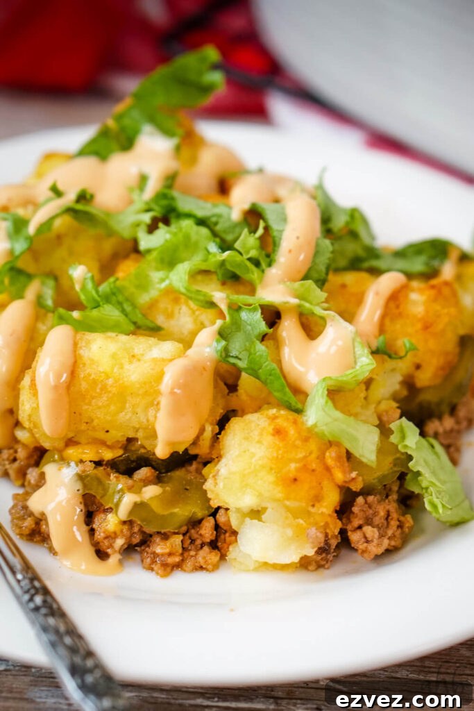 Big Mac Tater Tot Casserole Recipe: Cheesy Beef & Tots Bake 2 Big Mac Tater Tot Casserole topped with freshly shredded lettuce and Thousand Island dressing.