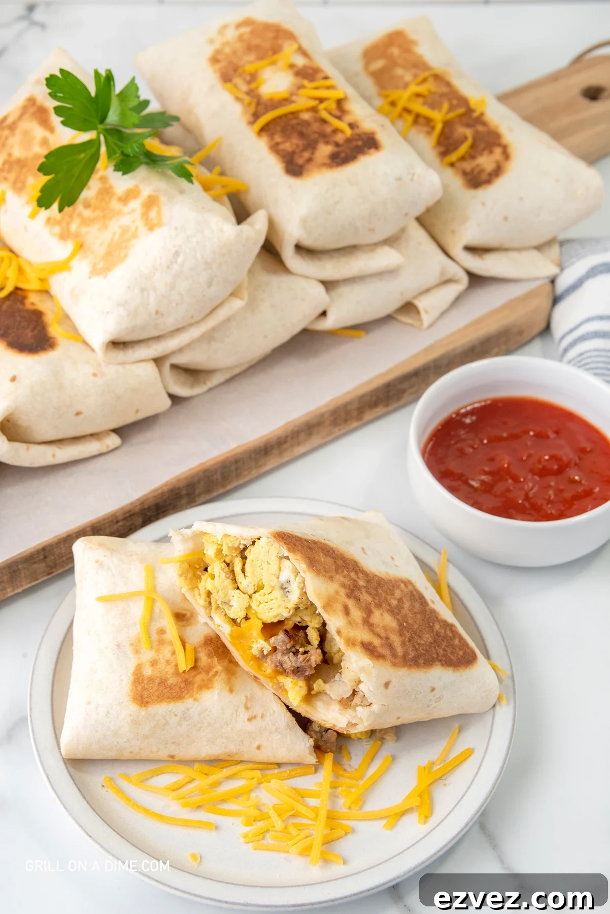 Breakfast Burritos cut in half and stacked on a plate