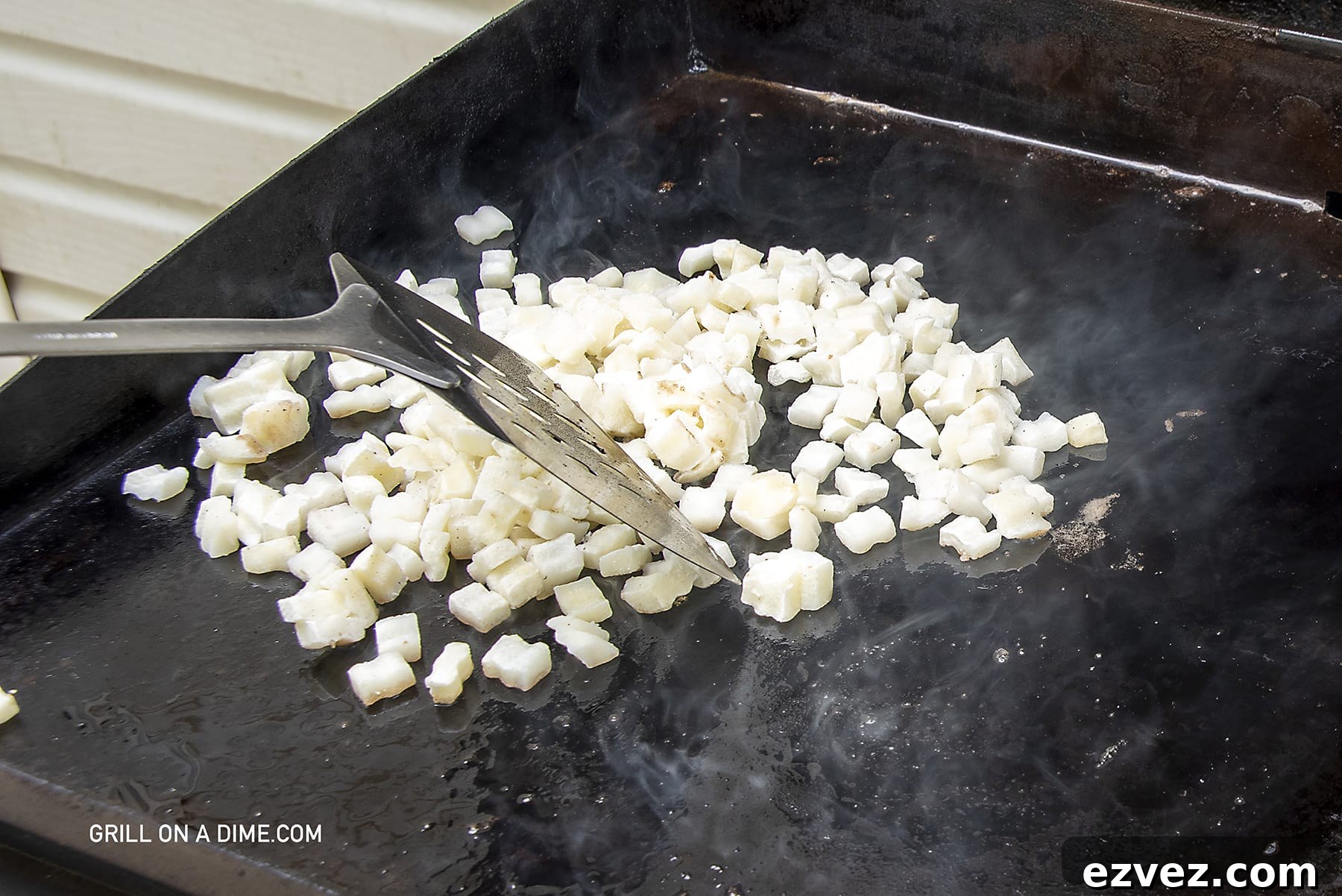 Cooking the hash browns on the griddle