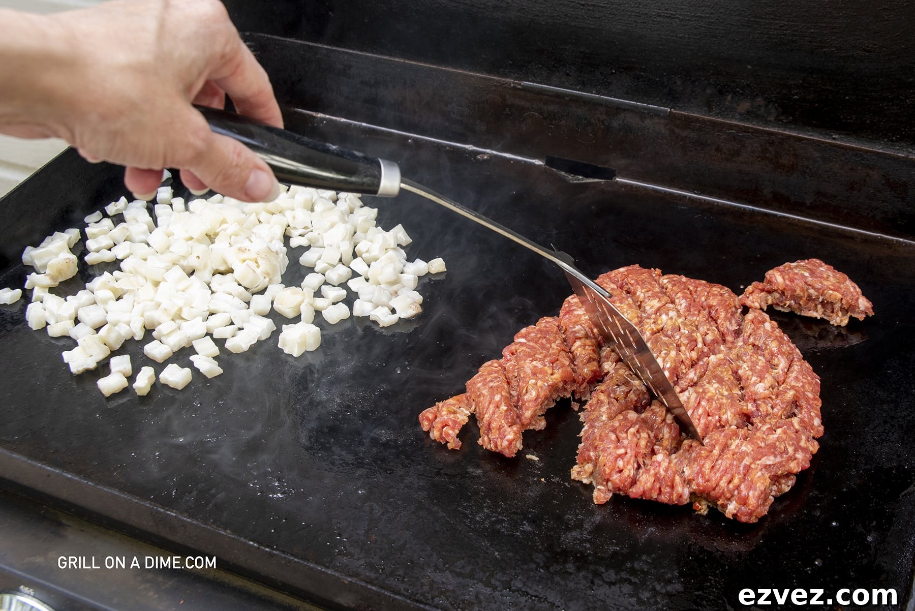 Hashbrowns on the griddle with ground sausage