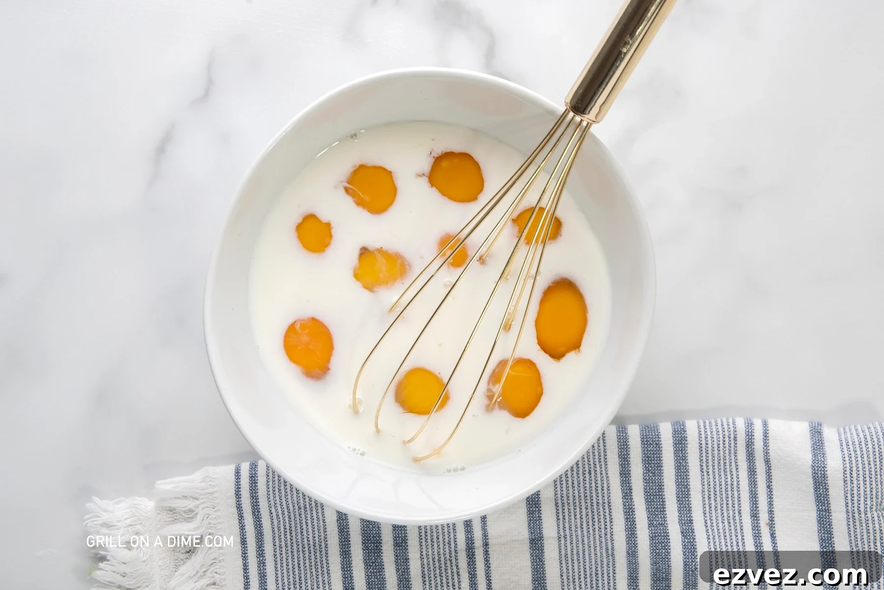 Whisking eggs and milk together in a bowl