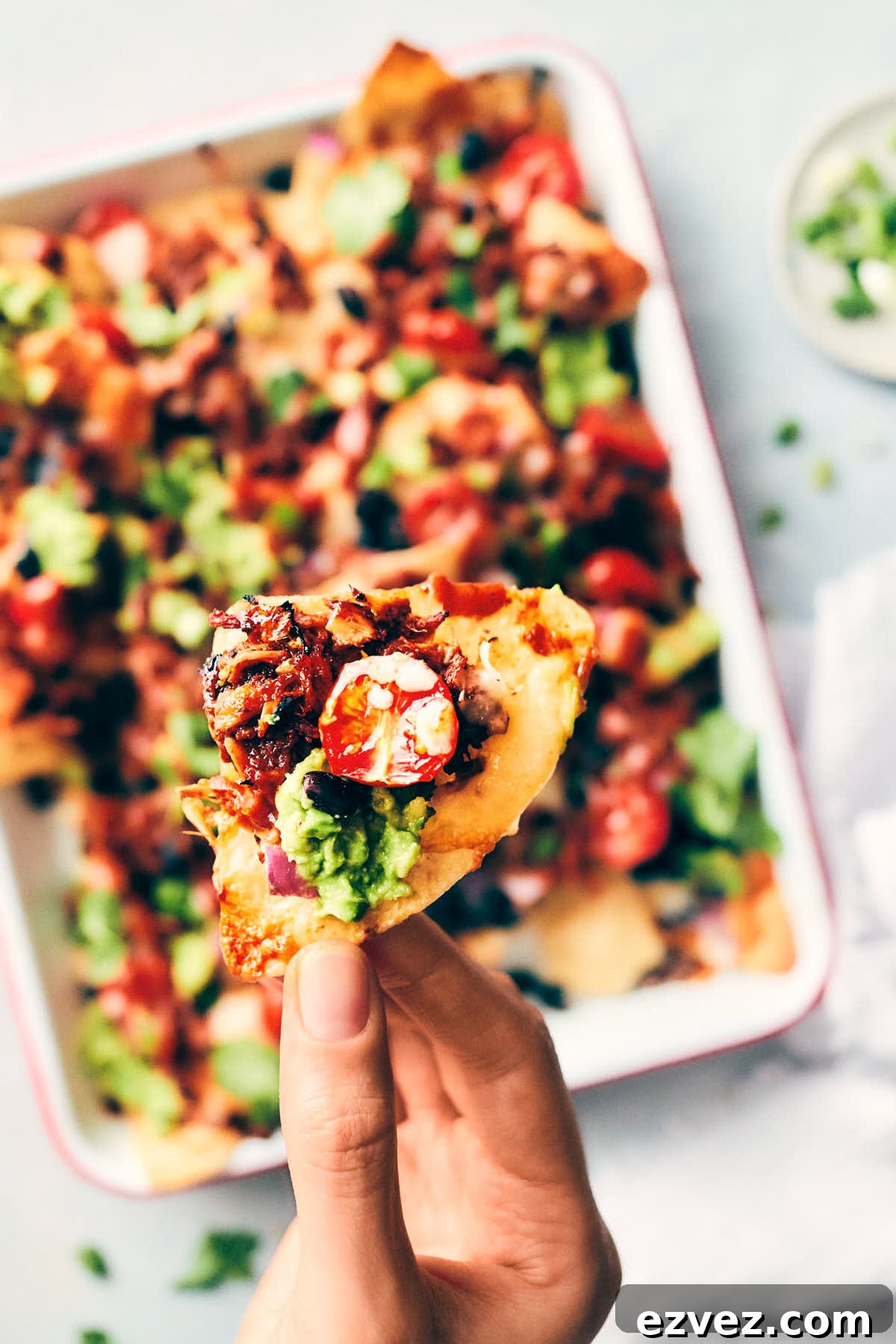 Single pulled pork nacho with vegan pulled pork that was cooked in homemade barbecue sauce