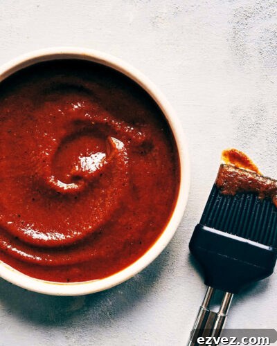 Close up of homemade barbecue sauce showing final texture in a bowl