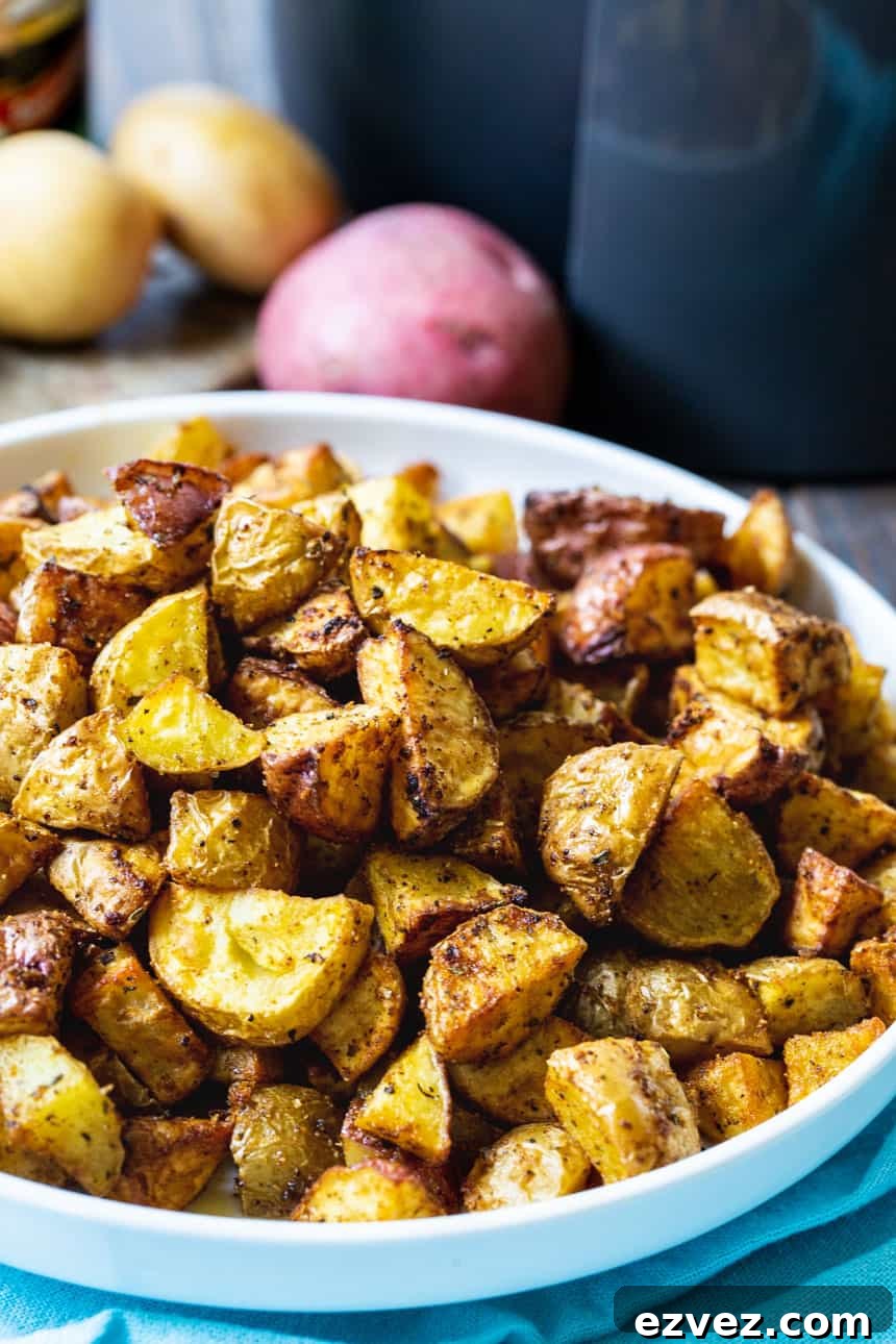 Air fryer Cajun Potatoes in a white bowl.