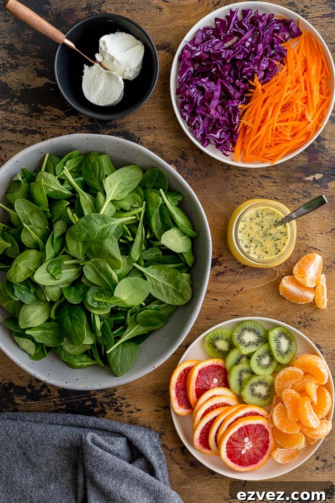 Ingredients to make Winter Salad arranged on a wooden surface.
