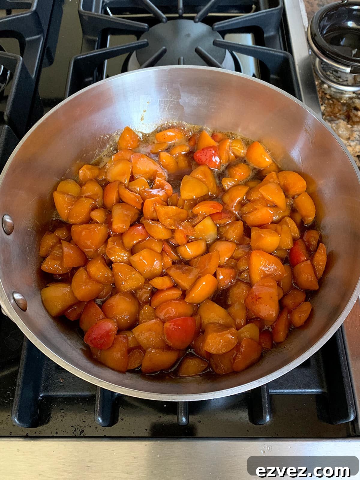 Apricot Jam with Brown Sugar in a pot cooking on the stove.