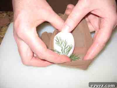 How to Dye Easter Eggs: Creative Techniques and Color Ideas 5 Tucking Easter Egg and leaf into pantyhose.