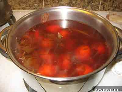 How to Dye Easter Eggs: Creative Techniques and Color Ideas 8 Easter eggs boiling in natural onion skin dye.