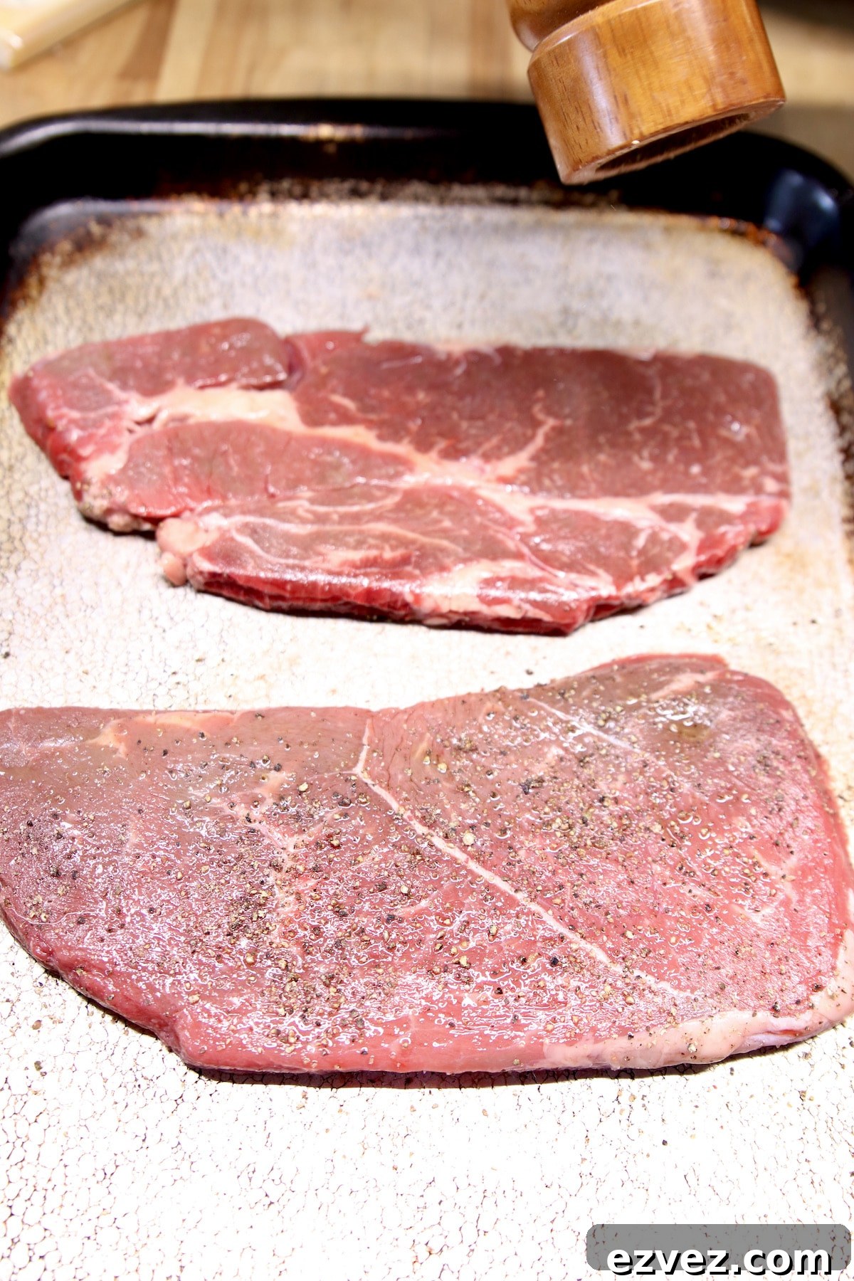 seasoning sirloin steak for grilling.