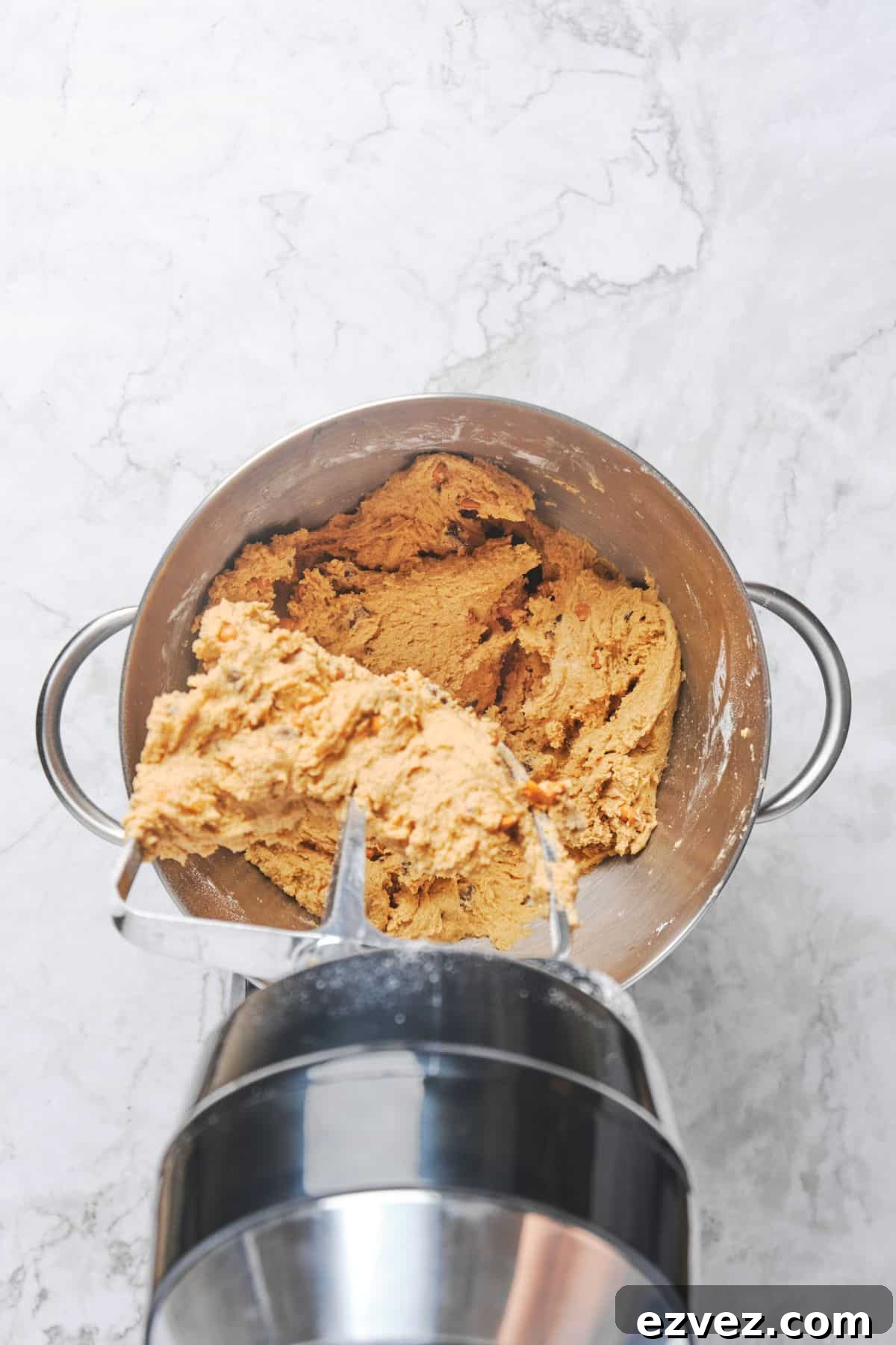 Butterscotch cookie dough that has just been blended before adding chocolate chips and butterscotch chips.